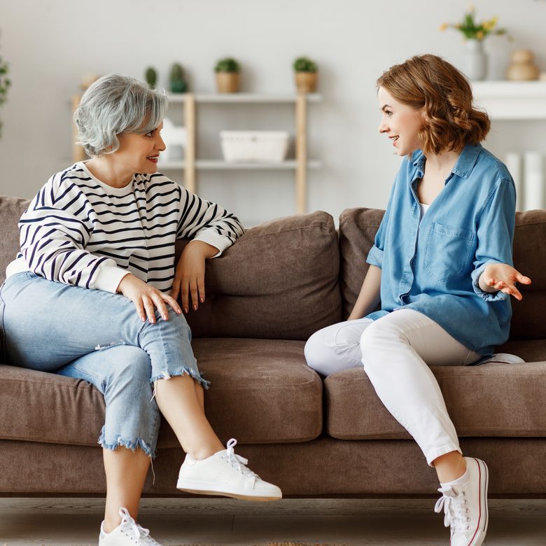 Younger woman having a conversation with a senior woman