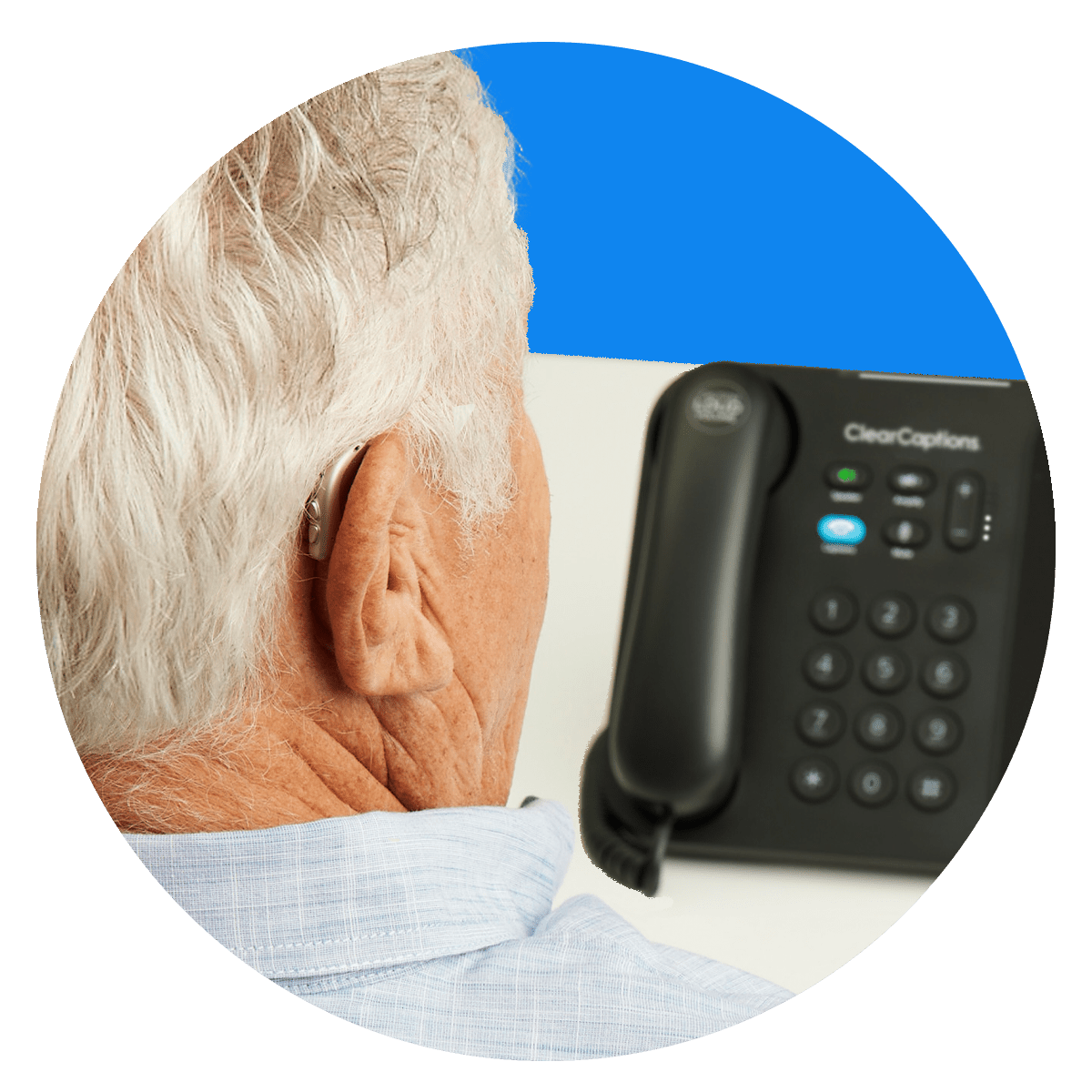 425b206f-b2e6-4618-b47b-1ae06a93c3ad Senior with hearing aid using the ClearCaptions caption phone
