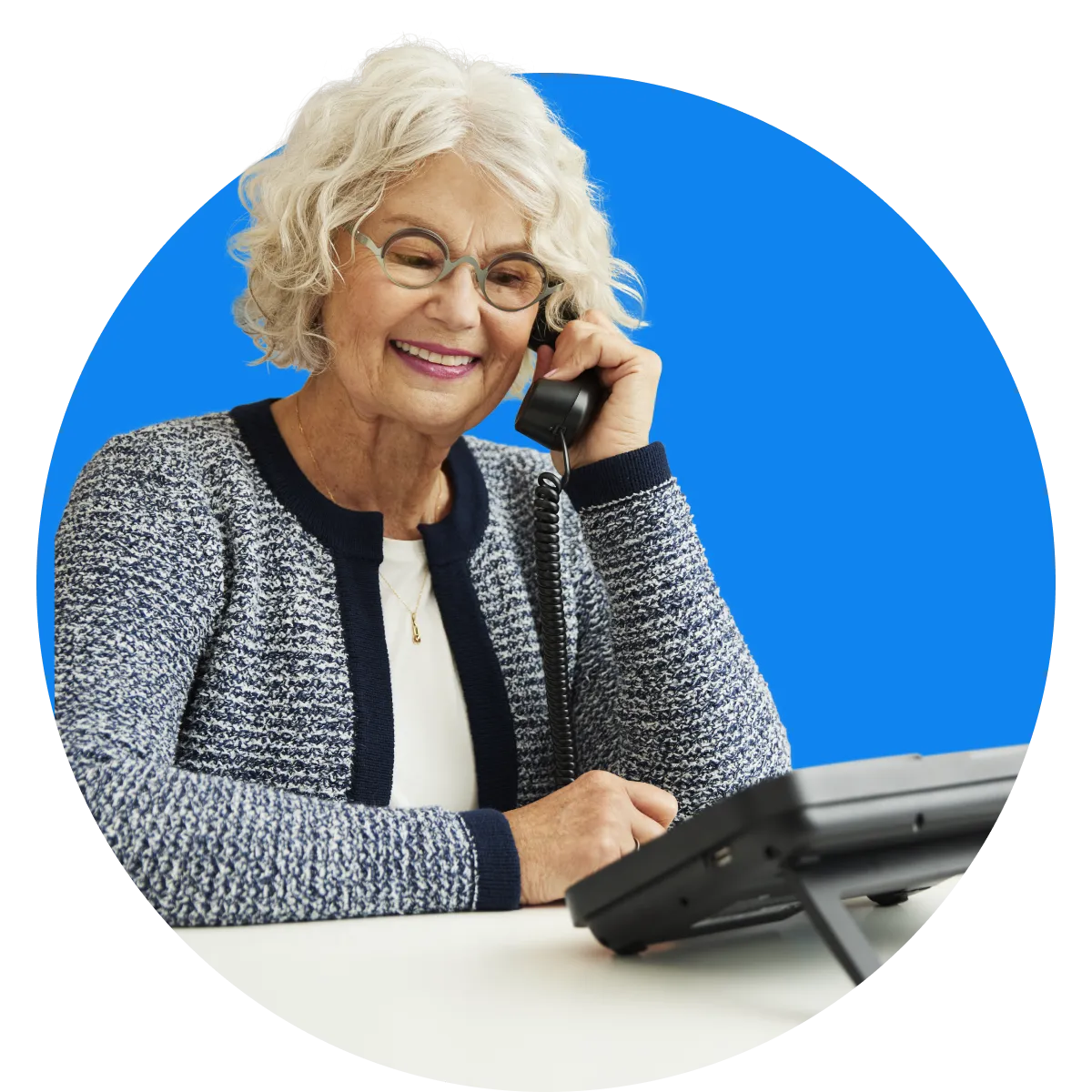 Barbara Smiling older woman using the ClearCaptions caption phone