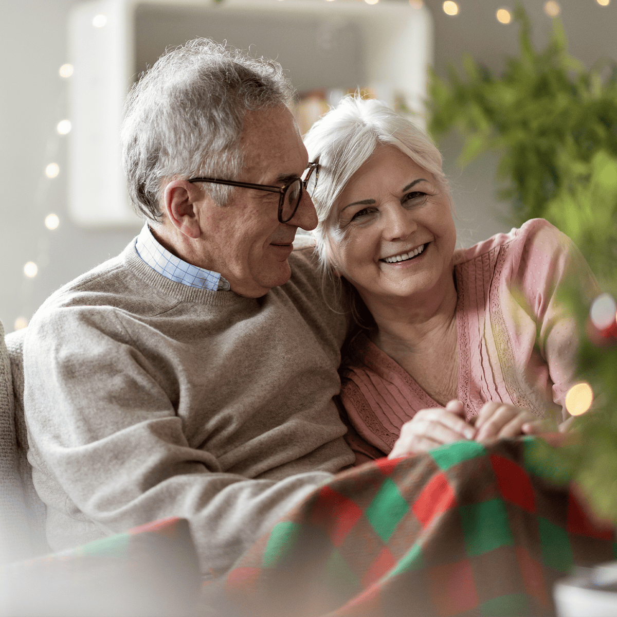 Senior couple hugging and smiling