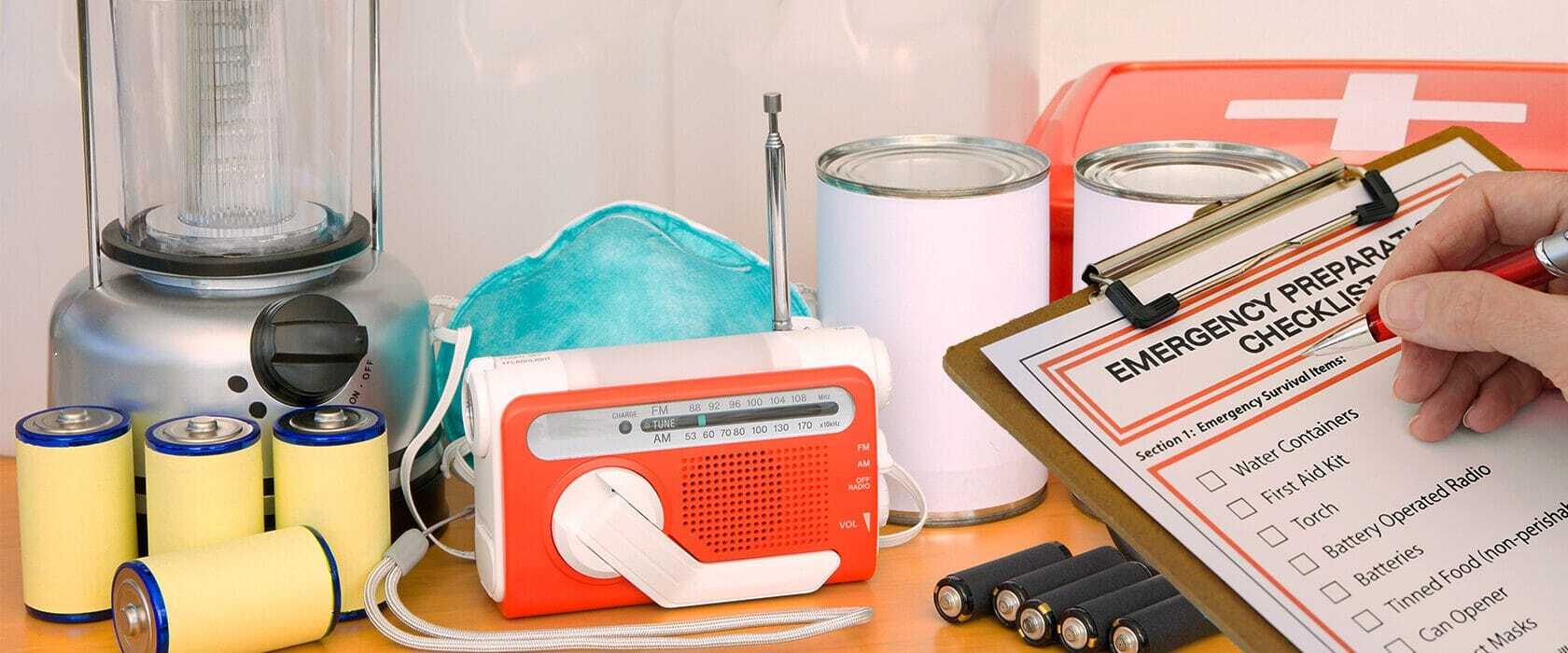 J3208_EmergencyPrep_HeaderFile-1680×700 Emergency preparation checklist surrounded by emergency items