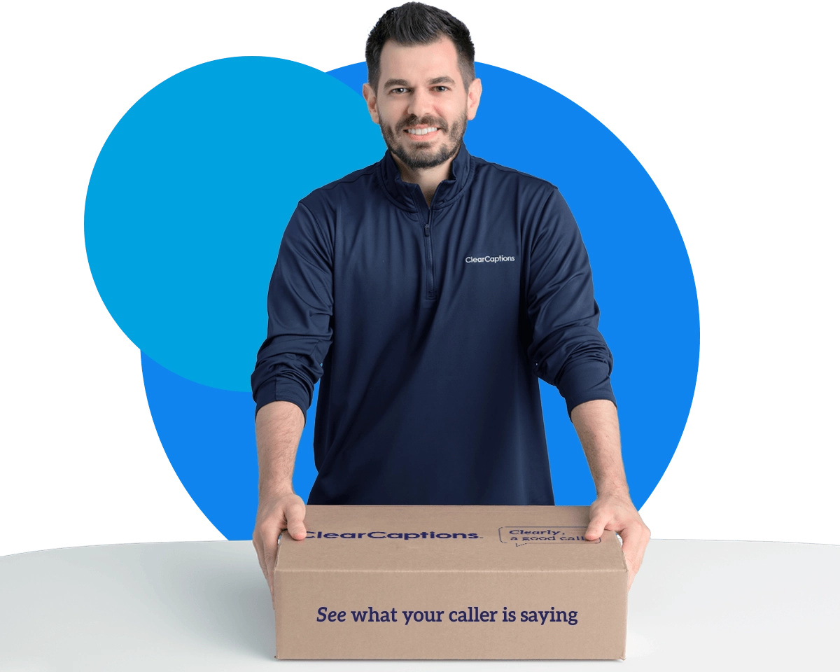 Update_Section 3_Cell 3 (2) Delivery worker holding a ClearCaptions box with a caption phone