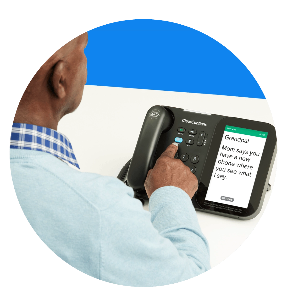 Senior using the ClearCaptions caption phone