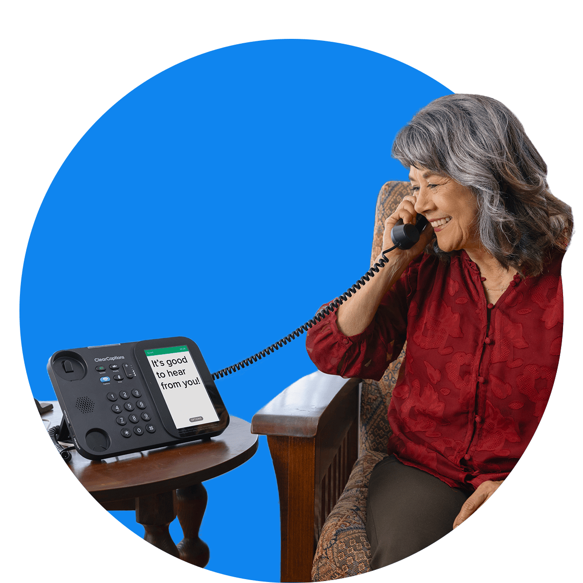 Section-2_Woman Smiling older woman using the ClearCaptions caption phone