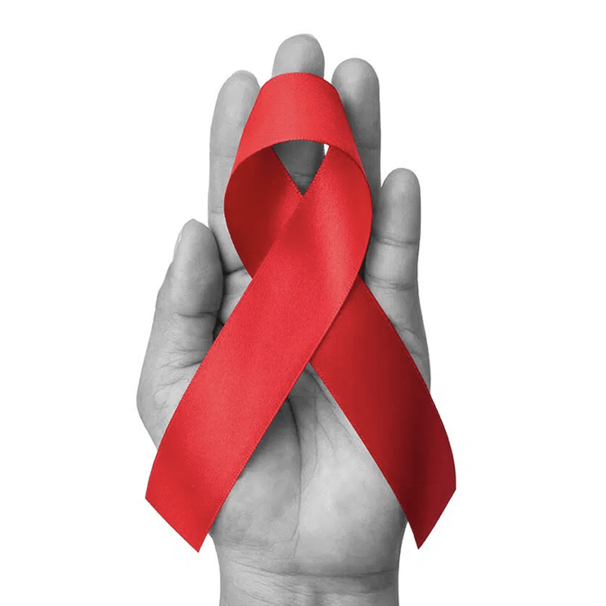 Hand holding a red awareness ribbon