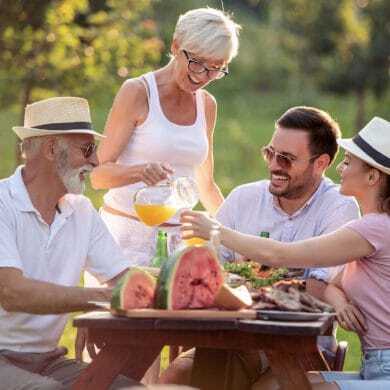 Family enjoying a picnic on a sunny day in the park