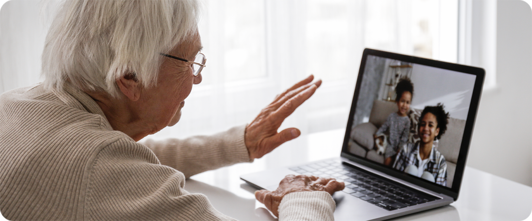 Grandparent talking through laptop video call