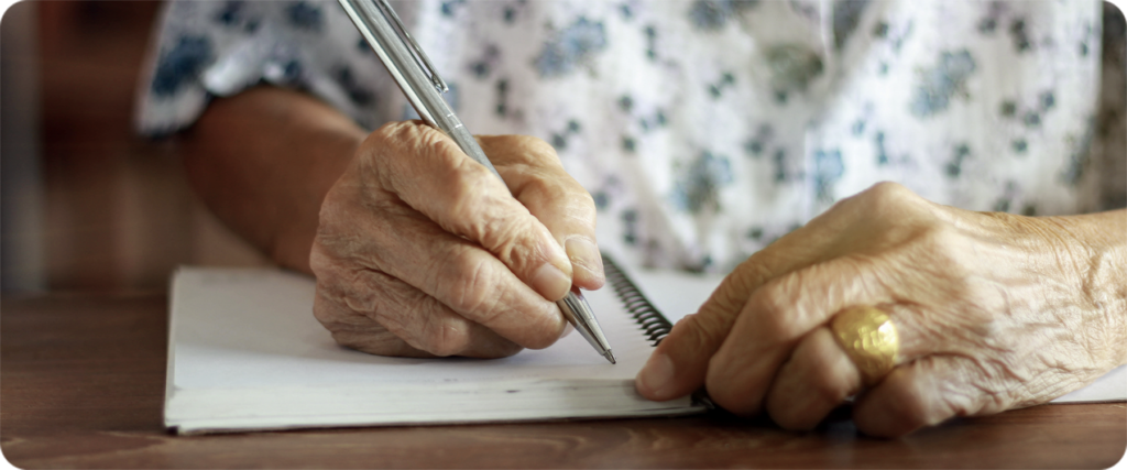 Grandparent writing a note