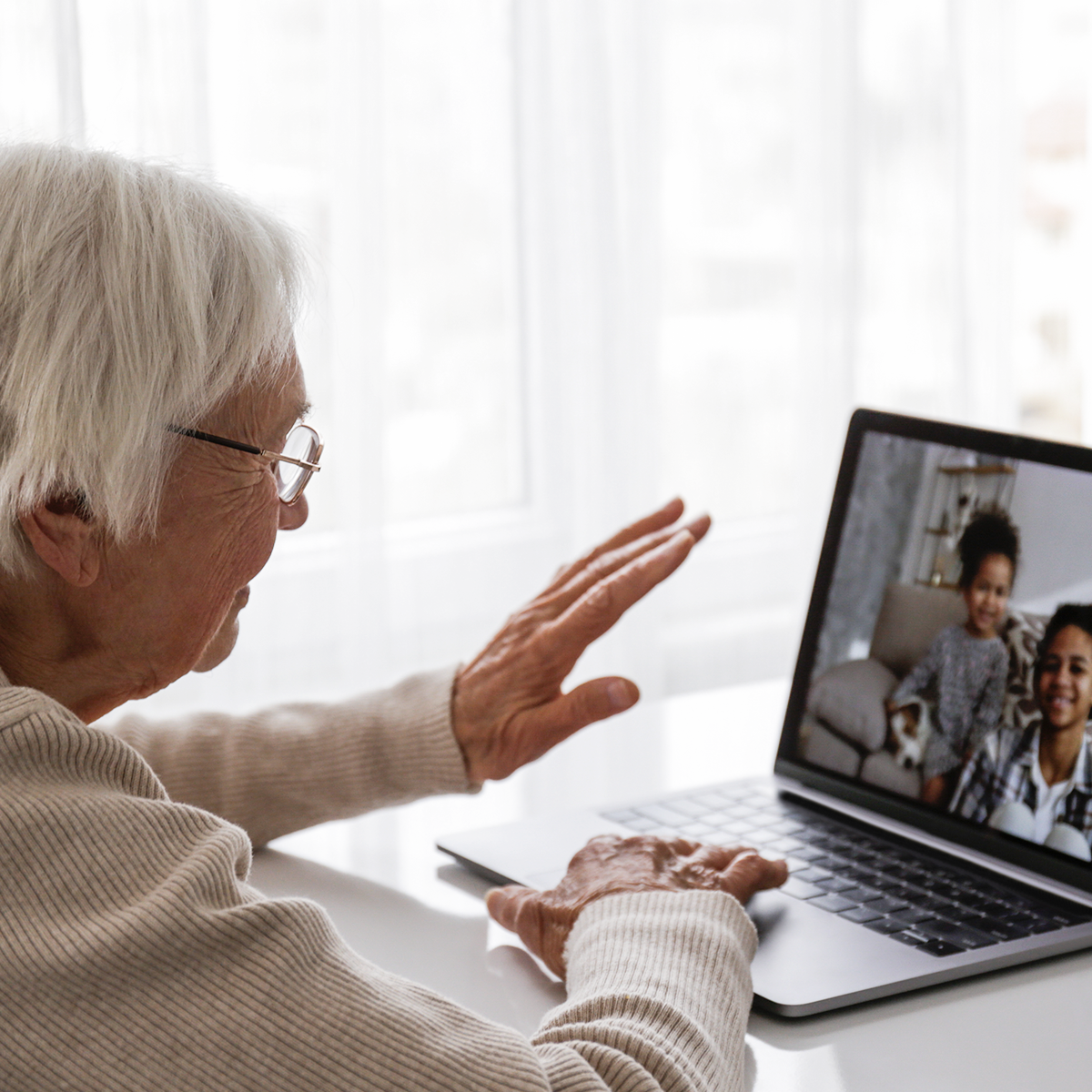 Grandparent talking through laptop video call